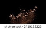 Coffee roasted bean ground fly explosion, Coffee crushed ground float pouring mix with beans. Roasted Coffee bean powder ground dust splash explosion in mid Air. Black background Isolated gold bokeh