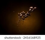 Coffee roasted bean ground fly explosion, Coffee crushed ground float pouring mix with beans. Roasted Coffee bean powder ground dust splash explosion in mid Air. Black background Isolated gold bokeh