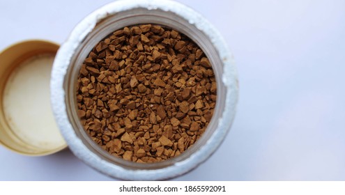 Coffee seeds in the pot with white background photo