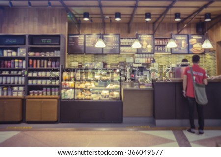 coffee shop blur background with bokeh image,in vintage effectCustomers enjoy coffee and delicious food.