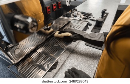 Coffee Shop Cleaning Staff Maintaining Espresso Machine in Modern Cafe Environment - Powered by Shutterstock