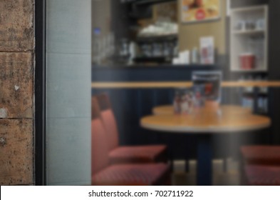 Coffee shop glass door mockup. Empty space on window for add logo