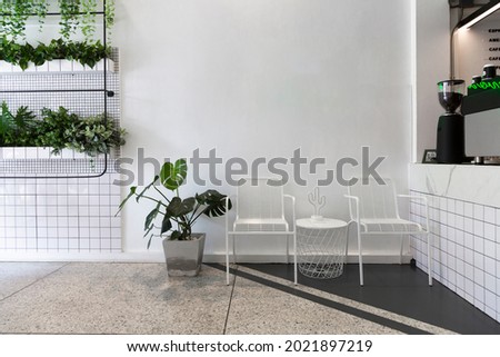 Coffee shop interior design With chairs and white walls. Empty on people.