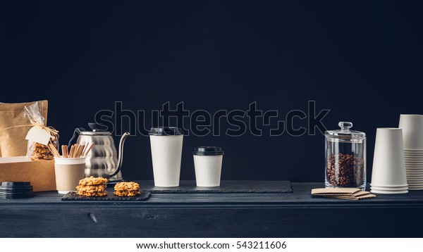 Coffee shop interior, Coffee to go and accessories\
on the table