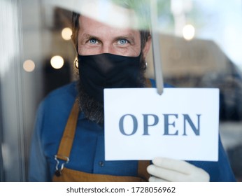Coffee Shop Man Owner With Face Mask, Open After Lockdown Quarantine.