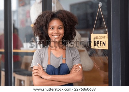 Coffee shop manager welcome to customer in the morning day