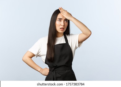 Coffee Shop, Small Business And Startup Concept. Annoyed And Fed Up Female Barista Tired Having Strange Clients, Facepalm, Punch Forehead And Eye Roll From Annoyance, Wear Black Apron