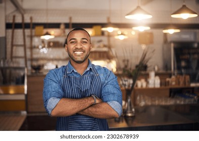 Coffee shop, waiter and portrait of African man in restaurant for service, working and crossed arms in cafe. Small business owner, bistro startup and male barista smile in cafeteria ready to serve - Powered by Shutterstock