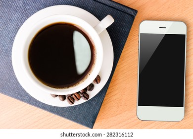 coffee and smartphone mobile on wood table