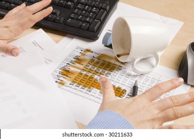 Coffee Spilled On Important Documents At A Desk