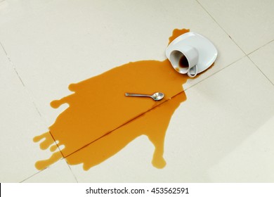 Coffee Spilled On The White Floor 