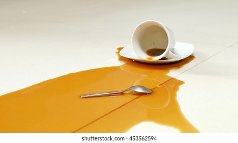 Coffee Spilled On The White Floor 