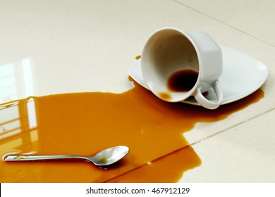 Coffee Spilled On The White Floor
