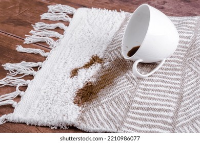 Coffee Spilling From Cup On Carpet. Domestic Life. The Concept Of Cleaning Stains. High Quality Photo