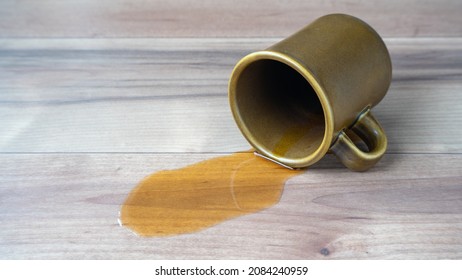 Coffee spills on the floor. - Shutterstock ID 2084240959