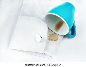 Coffee spot on white shirt sleeve.Wanishing concep.Dirty clothing.