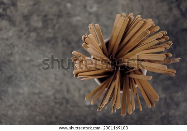 Coffee Stirrers On A Cafe\
Counter