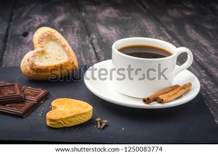 Coffee and sweets on a wooden table