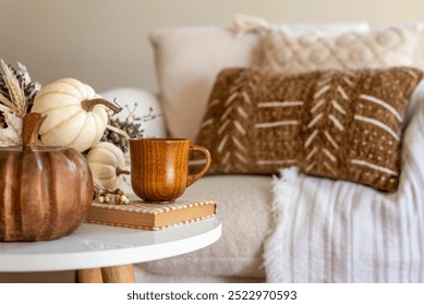 Coffee table decorated with fall decor in a cozy home