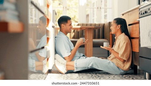 Coffee, talking and a happy couple at home with love, care and communication. Young woman and a man drinking tea together in an apartment to bond for happiness, quality time and commitment on a floor - Powered by Shutterstock