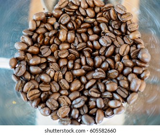Coffee texture. Roasted coffee beans in the coffee machine 