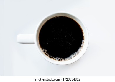 Coffee Top View. Black Coffee On A White Background. Coffee In A White Mug.