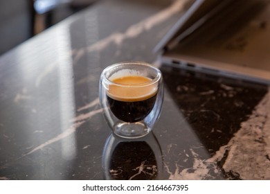 Coffee In Transparent Cup On Dark Marble Table