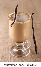 Coffee Vanilla Latte With Bean In Tall Glass On Hessian Background, Shallow DOF