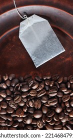 Coffee Vs. Tea. Tea Or Coffee? Coffee Beans And A Tea Bag. Choice Of Drink Concept Top View