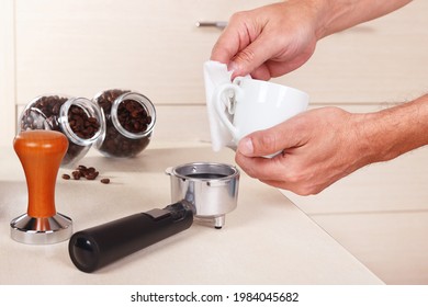 Coffeemaker Wipes Cup Before Making Coffee Above The Table.