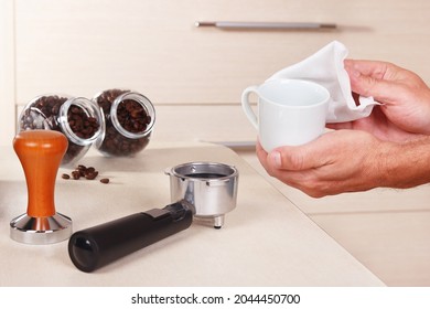 Coffeemaker Wipes Cup Before Making Espresso Above The Table.