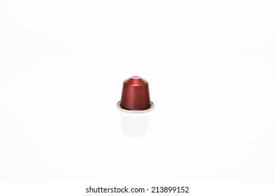 Coffee's capsule on white background with reflection