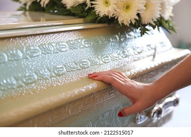 Coffin With Hand Supported In Sad Funeral. Tragedy, Deep Feelings, Concept, Life And Death, Faith, Spirituality, Eternity
