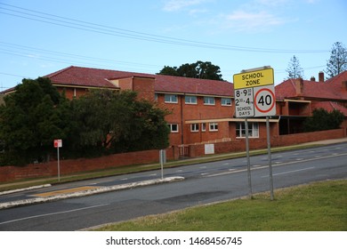 Coffs Harbour, NSW Australia - A High School With A Speed Sign Out The Front - School Zone