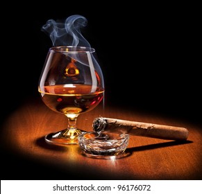 Cognac And Cigar With Smoke  On Black Background