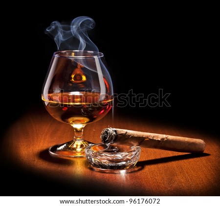Cognac and Cigar with smoke  on black background