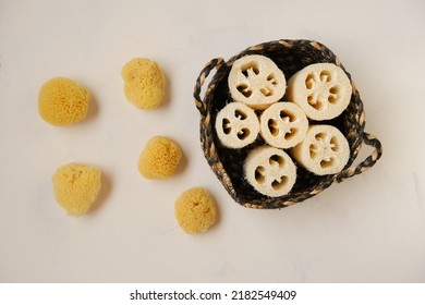  Cognac Sponges And Loofah Washcloths In A Wicker Basket On A Light Beige Background.Zero Waste Hygiene Products. Bio Natural Cosmetics.reasonable Consumption