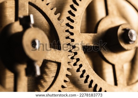 Cogwheels of a vintage clock, close up photo with selective soft focus