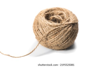 Coil of natural jute rope isolated on white background. Packaging cord roll, craft, eco-friendly natural rope coil. Tangled Thread. Hank of Twine close-up