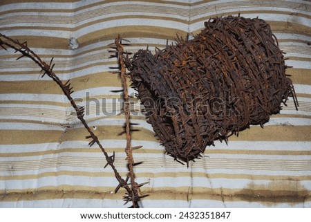 Coil of rusty barbed wire - 
Abstract concept: violation of human rights, imprisonment, cruelty