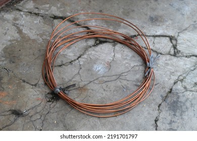 Coiled Copper Wire Lying On The Floor