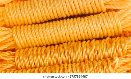 Coiled Yellow Nylon rope stack Close up texture background