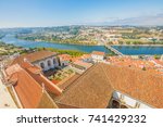 Coimbra cityscape and Santa Clara Bridge on Mondego river. Coimbra in Central Portugal, is famous for its University. Coimbra aerial view from bell clock tower in a sunny day.