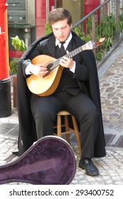 COIMBRA, PORTUGAL - CIRCA JUNE 2015: Unidentified Street Fado Guitar Player In Traditional Costume