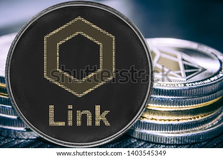 Coin cryptocurrency chainlink liink on the background of a stack of coins.