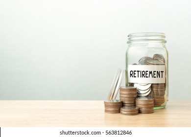 Coin In Jar With Money Stack Word Retirement, Concept Business Finance And Investment