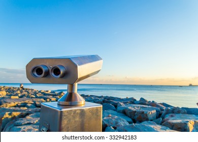 Coin operated binocular on the rocks  - Powered by Shutterstock