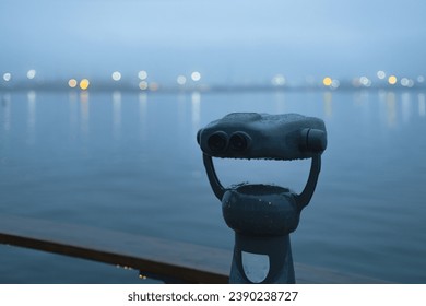 coin operated binoculars, tourist telescope overlooking the sea, sky and city lights - Powered by Shutterstock