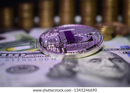 Coin physical Litecoin LTC, background from banknote and golden coins. Concept of cryptocurrency.