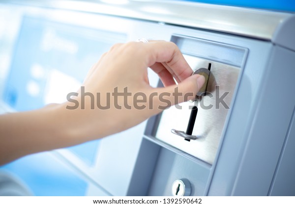 Coin slot of coin laundry vending machine, coin\
inserting by hand.